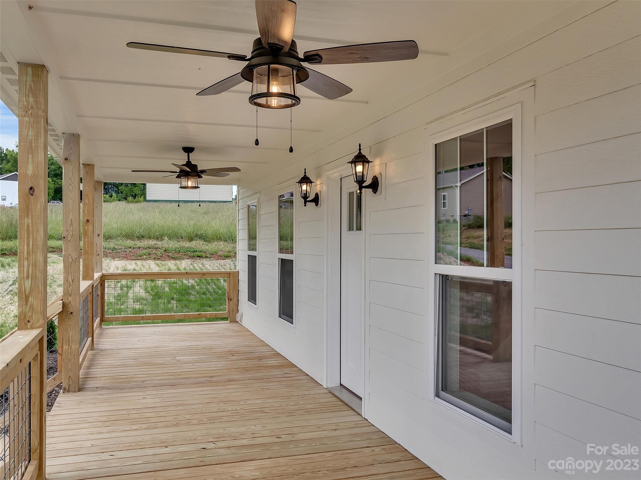 160 Rdg Vw Drive, Unit 21 Clyde, NC 28721 - Photo 11 of 39 wooden floor in a hall with an entryway