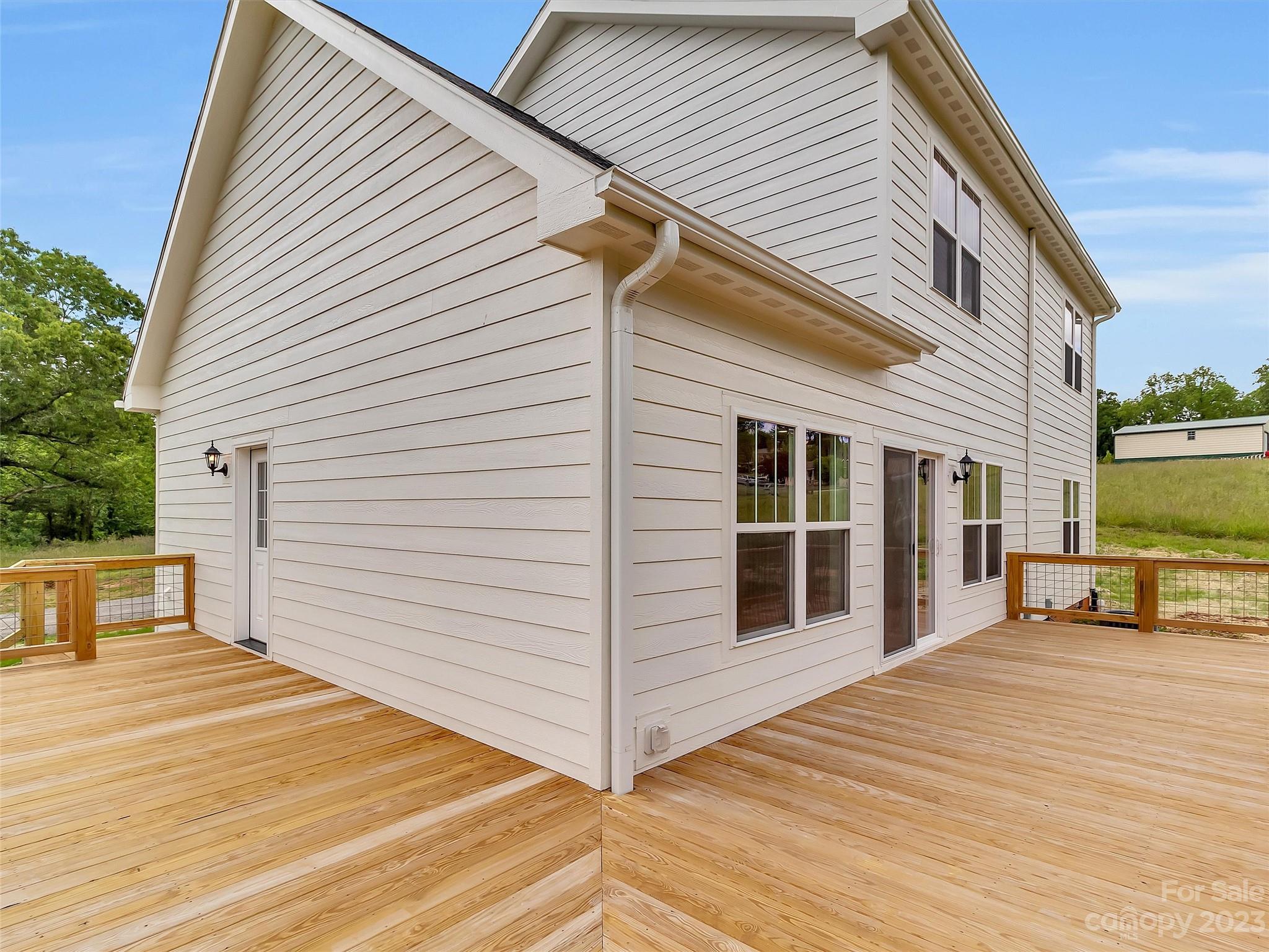 160 Rdg Vw Drive, Unit 21 Clyde, NC 28721 - Photo 12 of 39 a view of a house with backyard and sitting area
