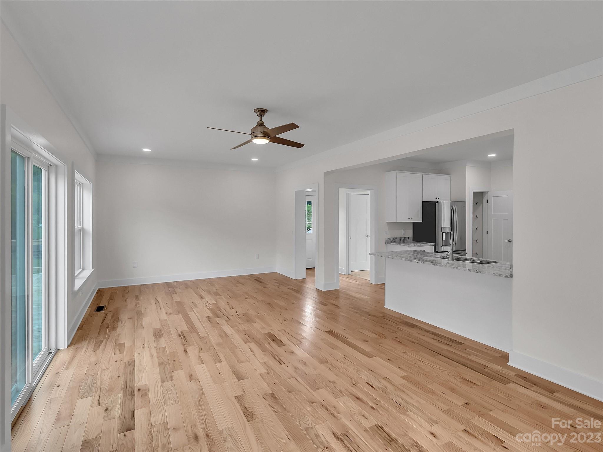 160 Rdg Vw Drive, Unit 21 Clyde, NC 28721 - Photo 19 of 39 a view of a kitchen with a sink and wooden floor