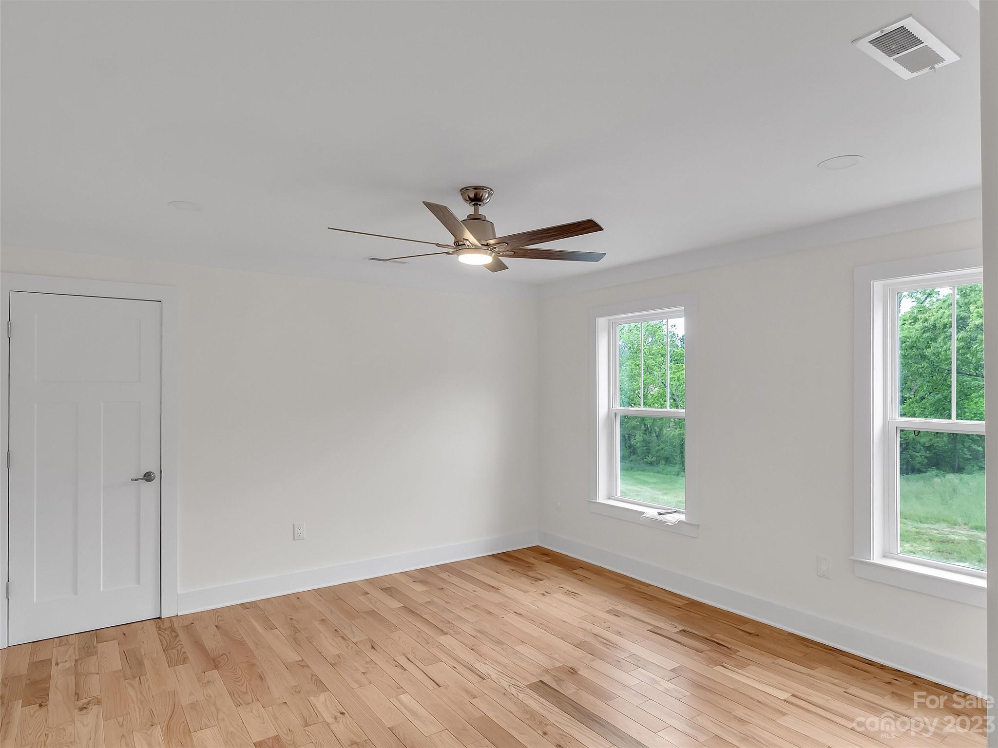 160 Rdg Vw Drive, Unit 21 Clyde, NC 28721 - Photo 33 of 39 a view of a big room with wooden floor and windows