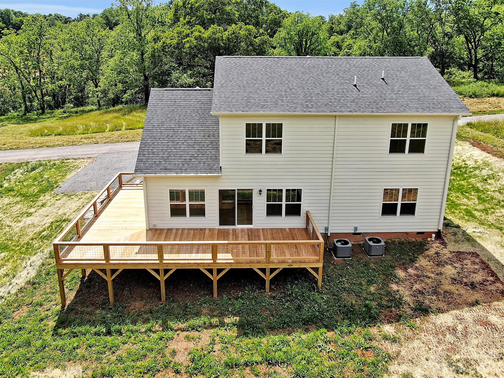 160 Rdg Vw Drive, Unit 21 Clyde, NC 28721 - Photo 5 of 39 a house view with a garden space