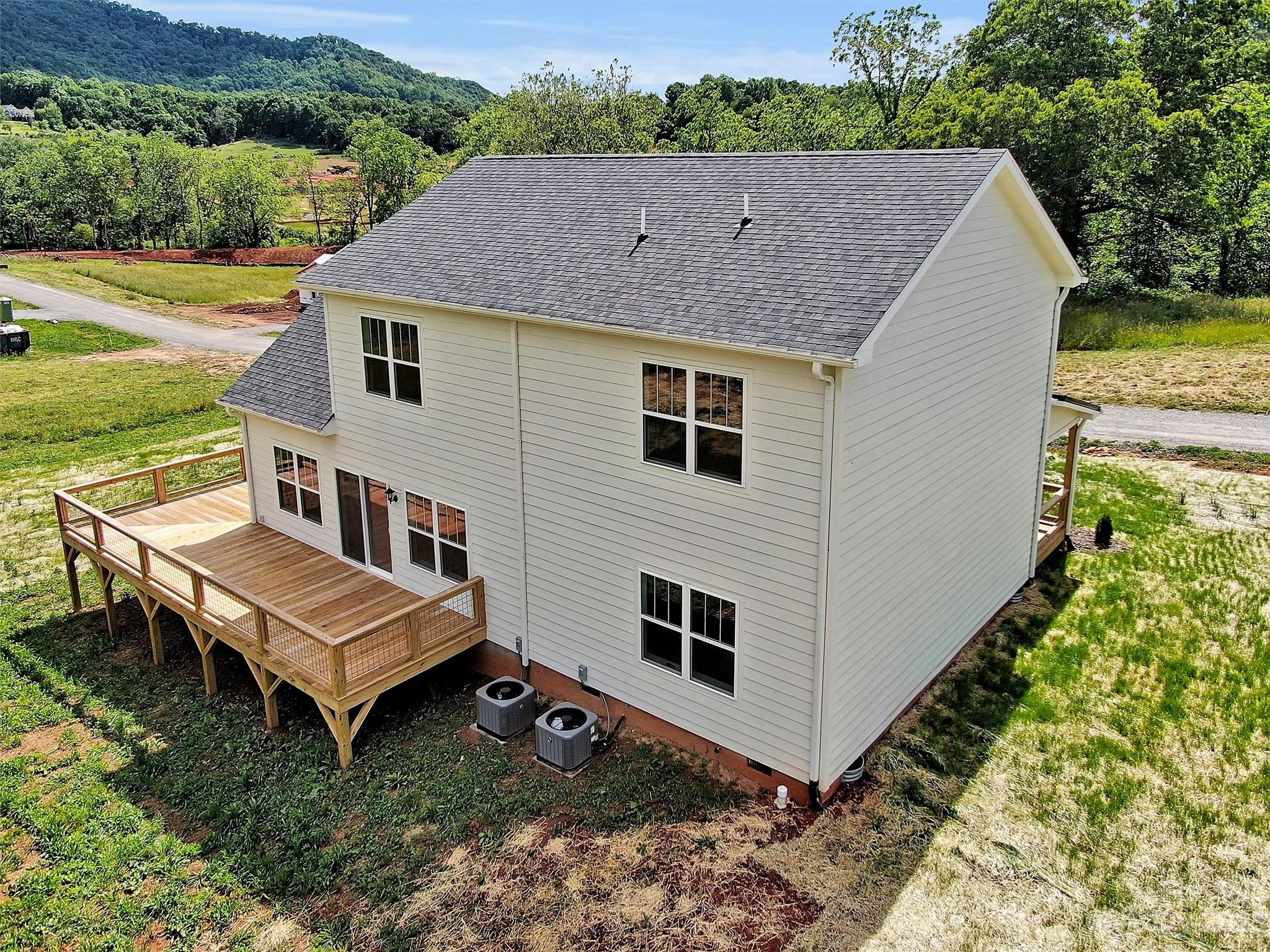 160 Rdg Vw Drive, Unit 21 Clyde, NC 28721 - Photo 6 of 39 a aerial view of a house with a yard