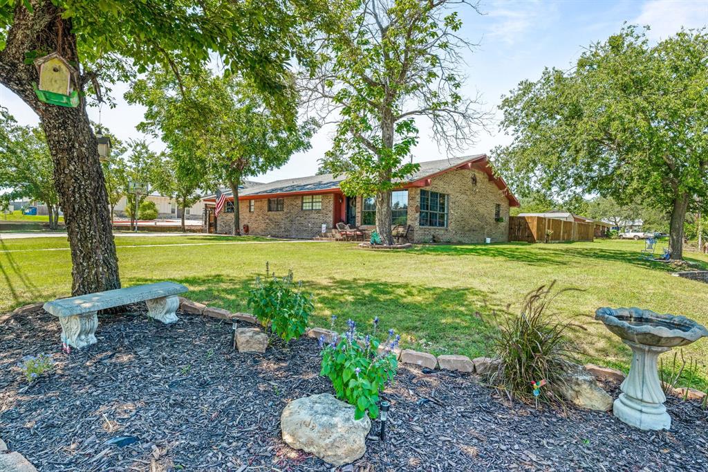 a view of a house with a yard porch and sitting area