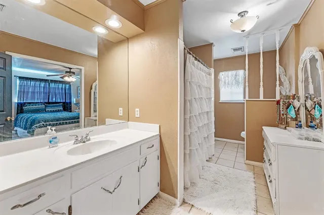 a bathroom with a sink double vanity and a mirror