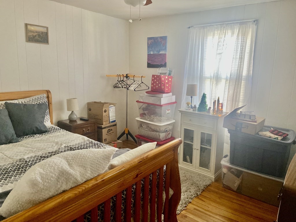 44 Brewster Road Waltham, MA 02451 - Photo 18 of 31 a bedroom with a bed and large window