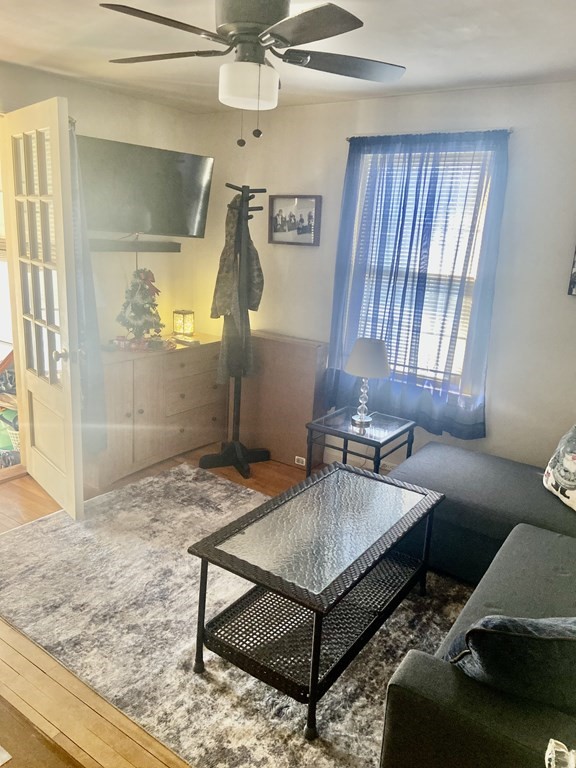 44 Brewster Road Waltham, MA 02451 - Photo 21 of 31 a living room with a couch and a table