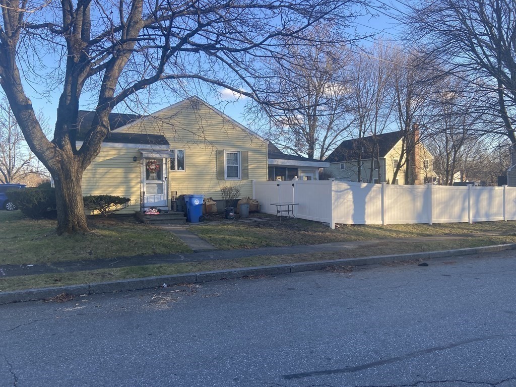 44 Brewster Road Waltham, MA 02451 - Photo 3 of 31 a front view of a house with a yard