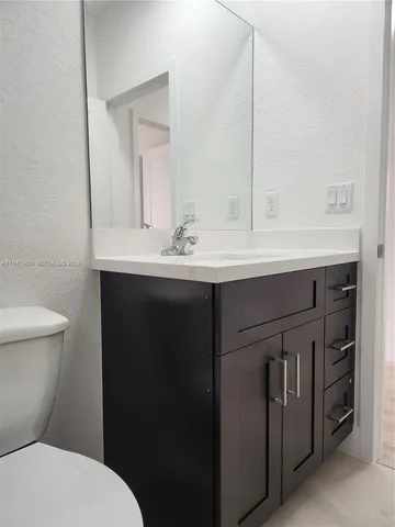 a picture of a bathroom with a shower