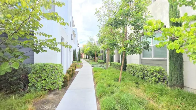 a view of a back yard with flower plants
