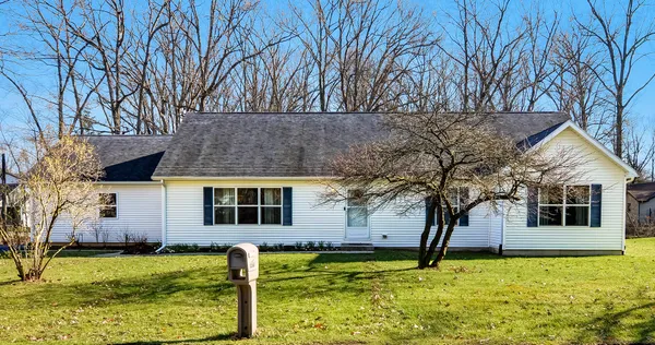 a front view of a house with yard