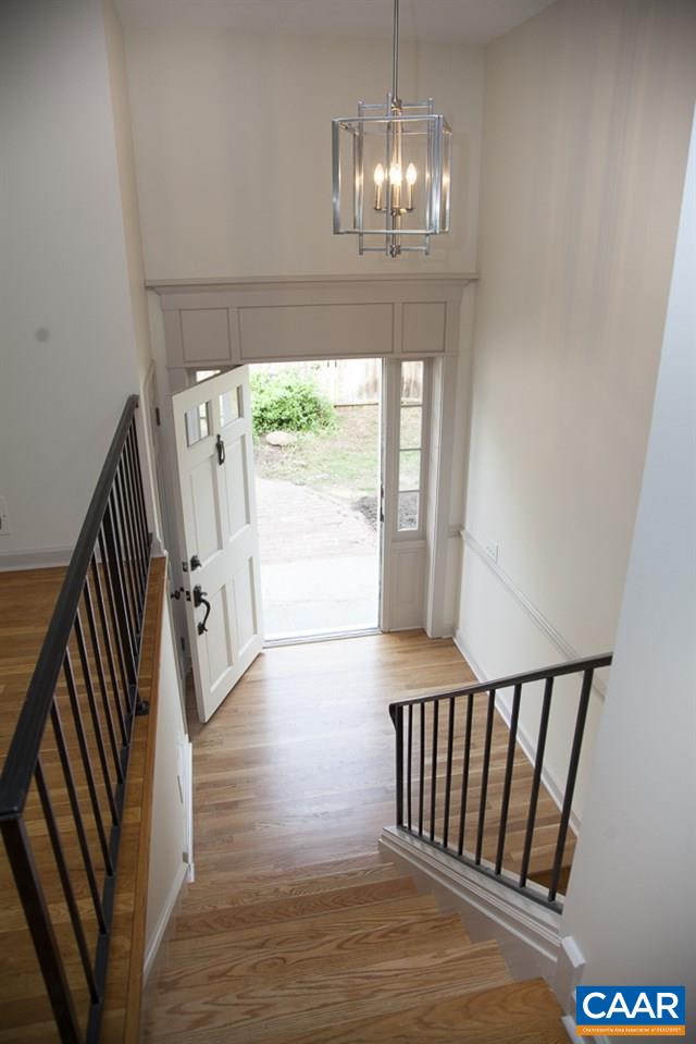 2405 Barracks Road Charlottesville, VA 22901 - Photo 17 of 48 a view of a livingroom with wooden floor and staircase