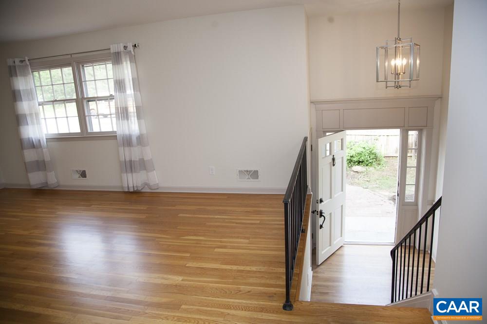2405 Barracks Road Charlottesville, VA 22901 - Photo 18 of 48 a view of empty room with wooden floor and fan