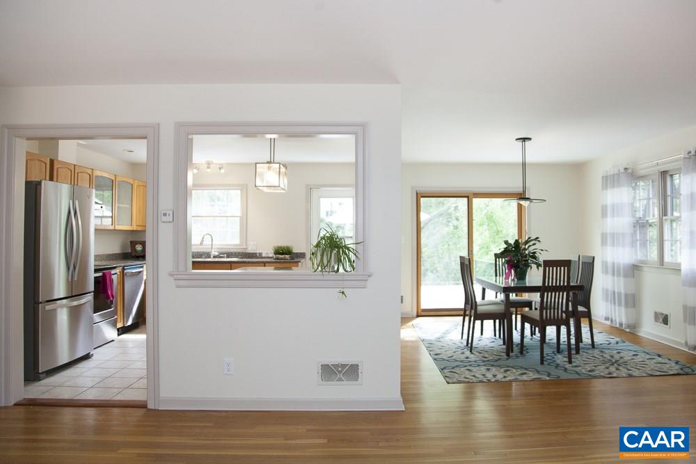 2405 Barracks Road Charlottesville, VA 22901 - Photo 19 of 48 a view of a dining room with furniture window and wooden floor