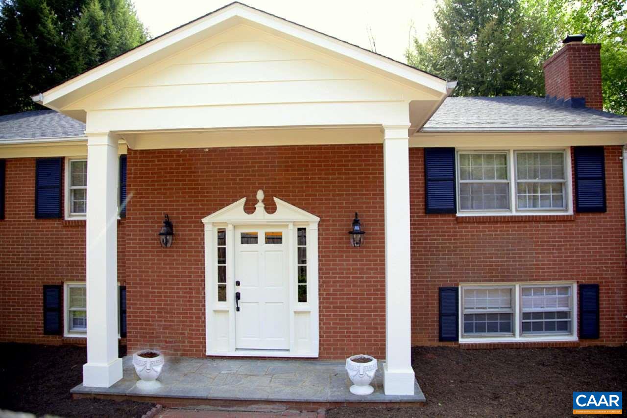 2405 Barracks Road Charlottesville, VA 22901 - Photo 2 of 48 a front view of a house with a yard