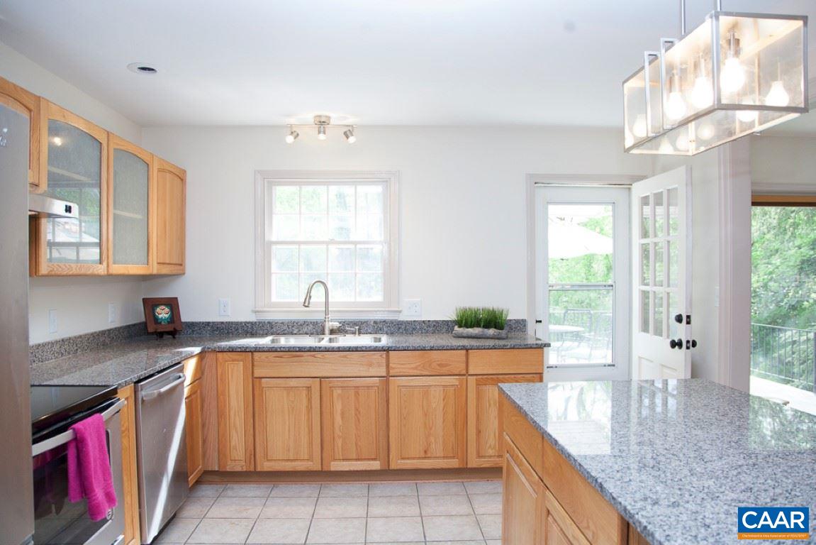 2405 Barracks Road Charlottesville, VA 22901 - Photo 21 of 48 a kitchen with granite countertop a sink a stove and cabinets