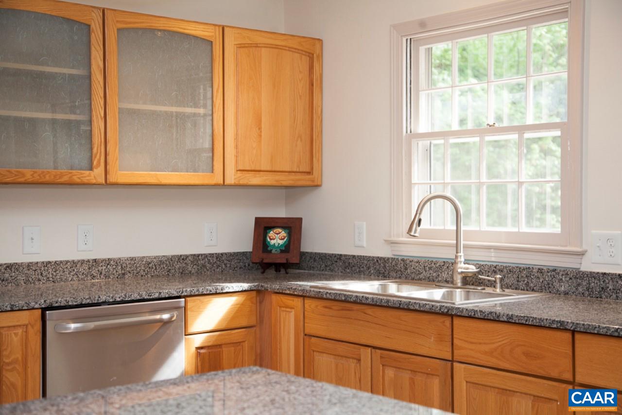 2405 Barracks Road Charlottesville, VA 22901 - Photo 22 of 48 a kitchen with granite countertop stainless steel appliances a sink window and cabinets