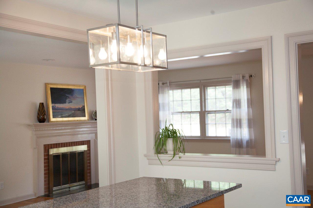 2405 Barracks Road Charlottesville, VA 22901 - Photo 24 of 48 a view of a livingroom with a chandelier wooden floor kitchen and windows