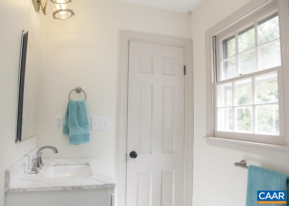 2405 Barracks Road Charlottesville, VA 22901 - Photo 32 of 48 a bathroom with a sink and a mirror