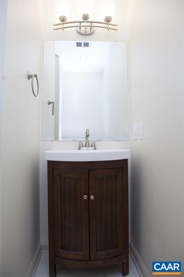 2405 Barracks Road Charlottesville, VA 22901 - Photo 38 of 48 a bathroom with a sink vanity and mirror