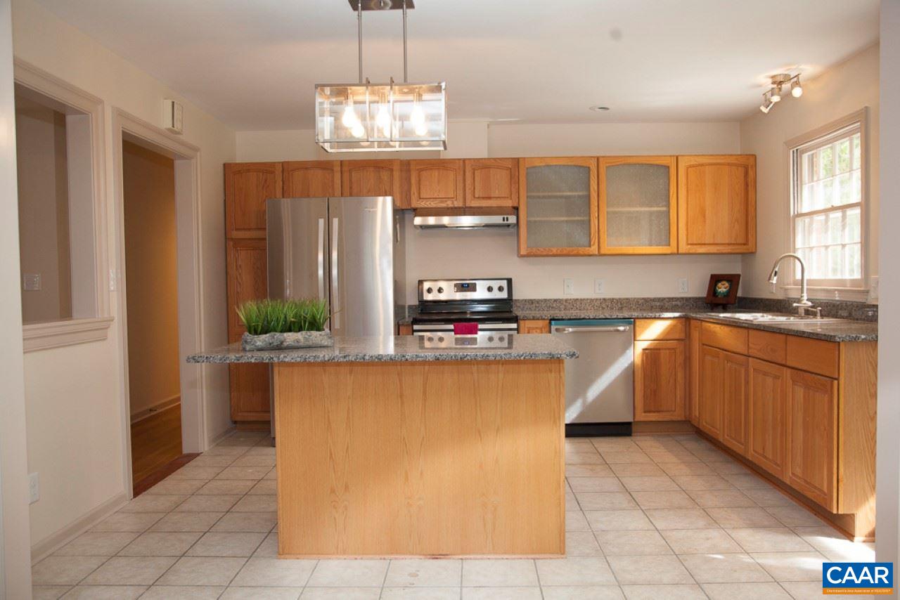 2405 Barracks Road Charlottesville, VA 22901 - Photo 4 of 48 a kitchen with stainless steel appliances granite countertop a sink counter space cabinets and a view of kitchen
