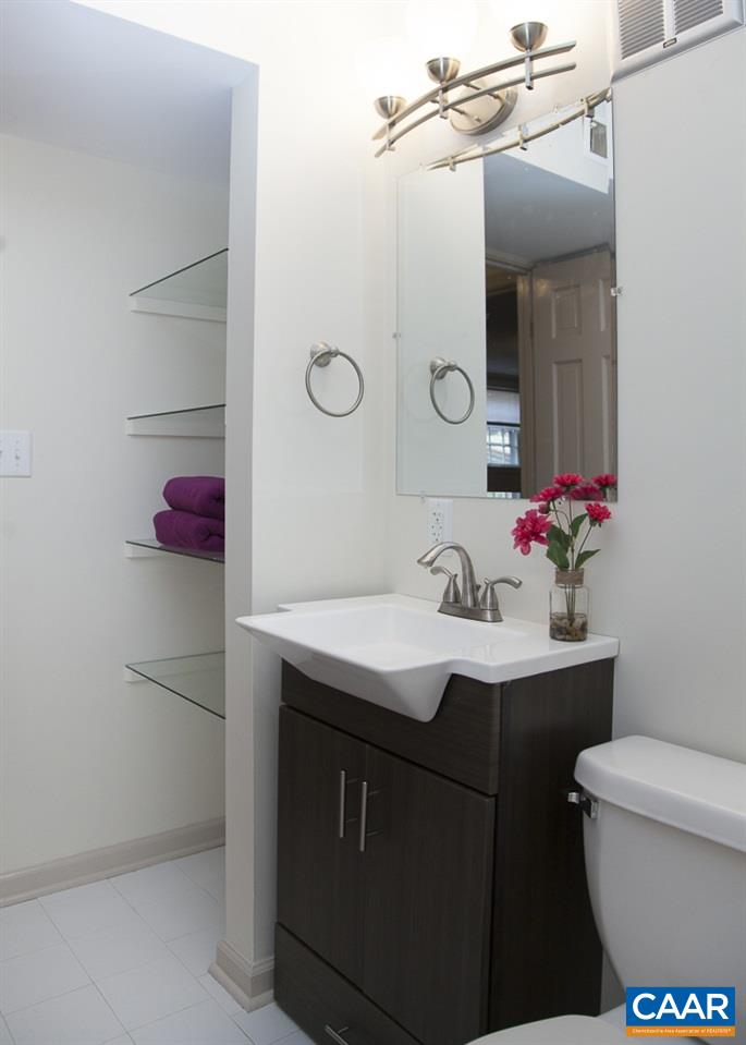 2405 Barracks Road Charlottesville, VA 22901 - Photo 43 of 48 a bathroom with a sink vanity mirror and toilet