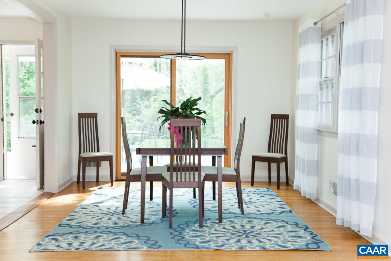2405 Barracks Road Charlottesville, VA 22901 - Photo 5 of 48 a view of a dining room with furniture window and wooden floor