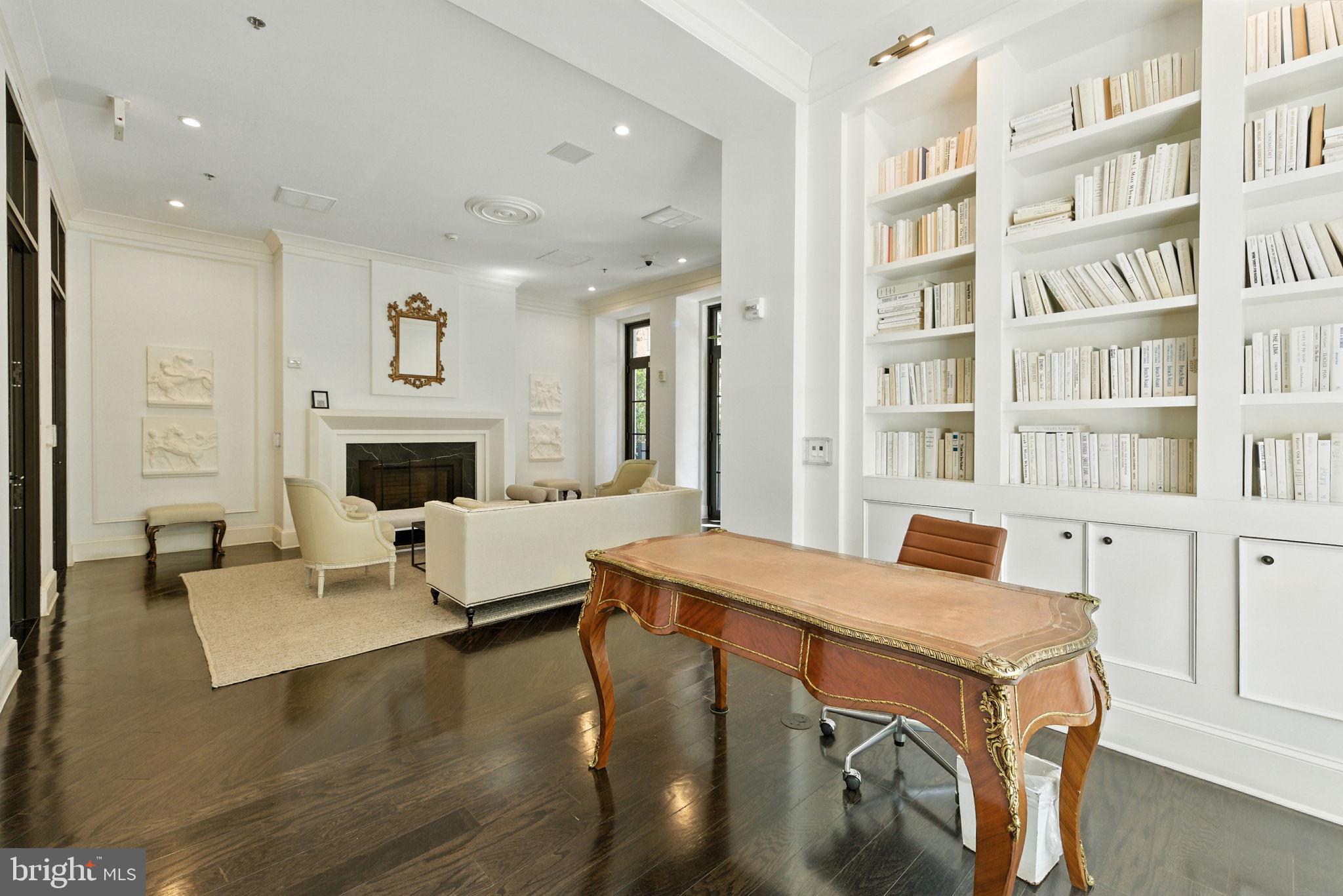 1011 M Street Northwest, Unit 901 Washington, DC 20001 - Photo 17 of 26 a living room with furniture and a fireplace