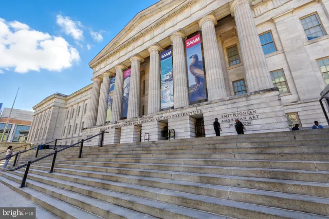 a view of a entrance gate of the house and a street