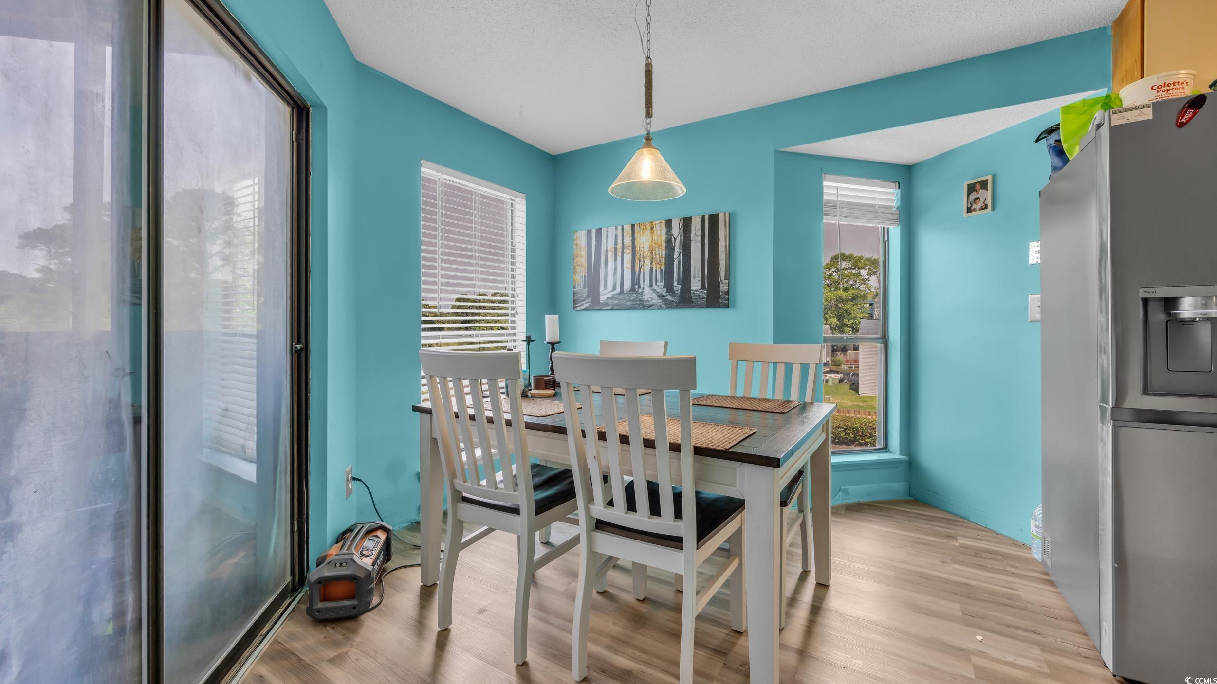 1101 Possum Trot Road, Unit C203 North Myrtle Beach, SC 29582 - Photo 11 of 29 Dining room with light wood-style floors