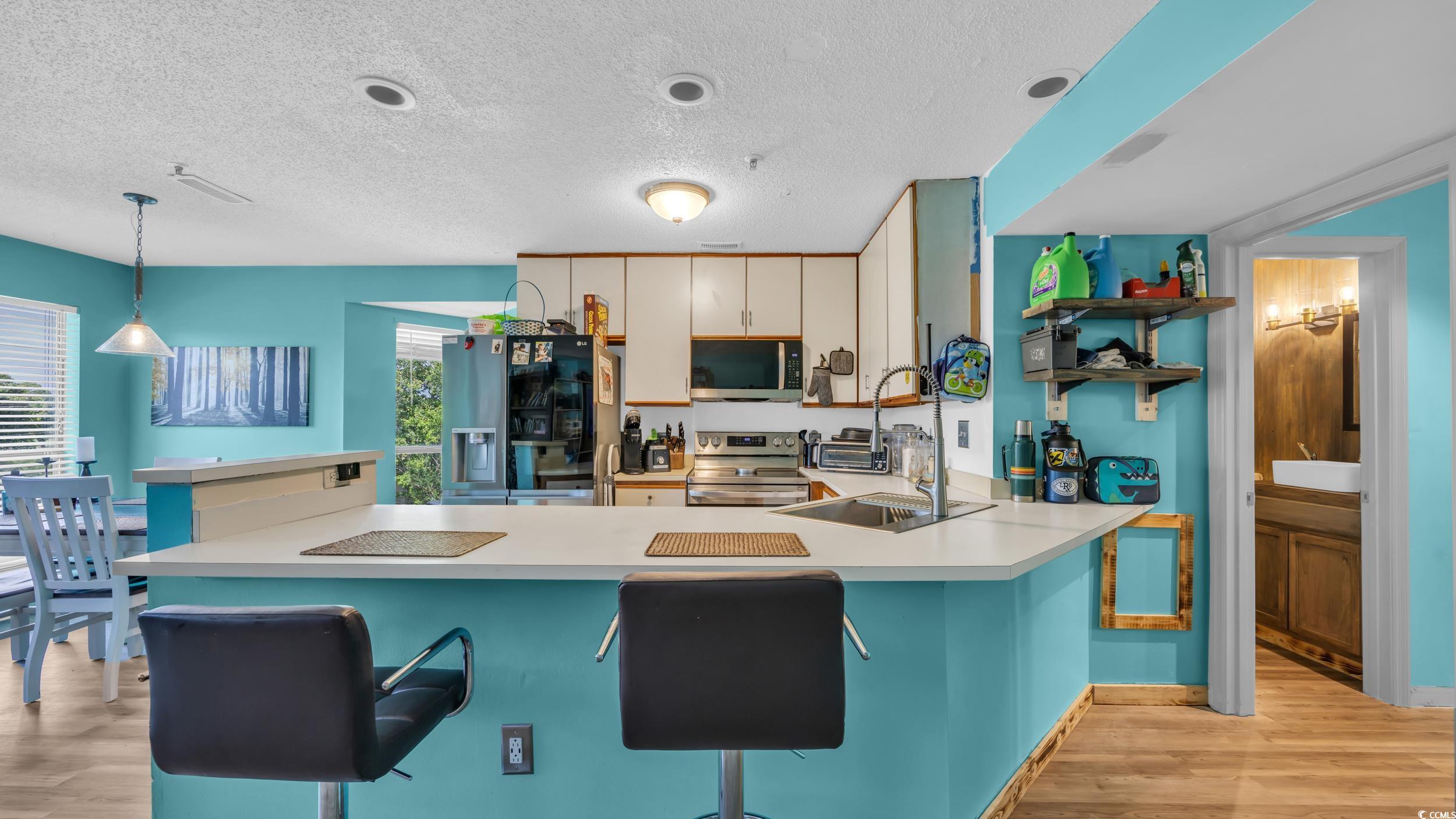 1101 Possum Trot Road, Unit C203 North Myrtle Beach, SC 29582 - Photo 13 of 29 Kitchen featuring stainless steel appliances, a te