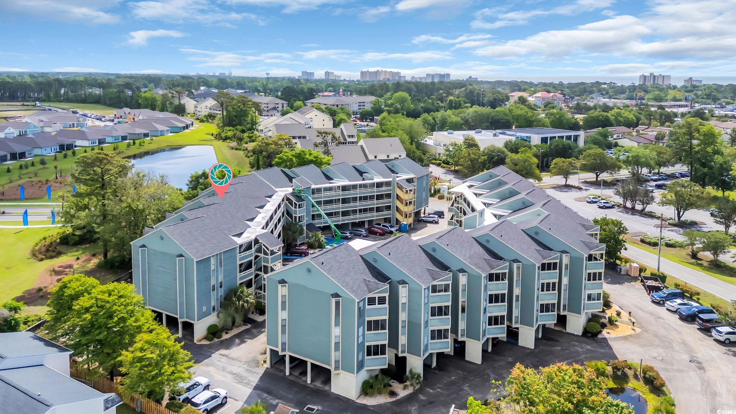1101 Possum Trot Road, Unit C203 North Myrtle Beach, SC 29582 - Photo 23 of 29 Aerial perspective of suburban area featuring a ne