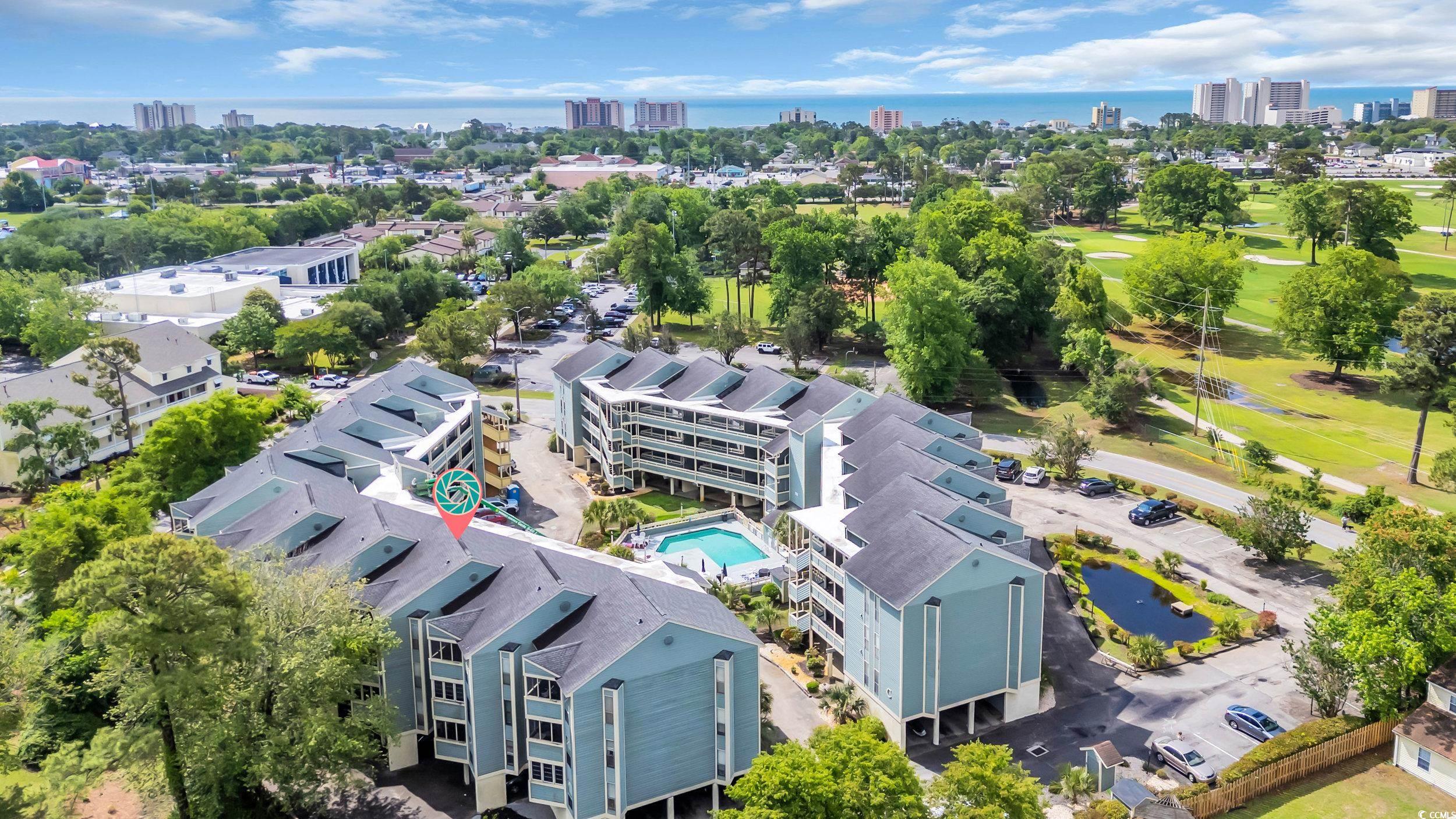 1101 Possum Trot Road, Unit C203 North Myrtle Beach, SC 29582 - Photo 25 of 29 View of urban area featuring a pool area