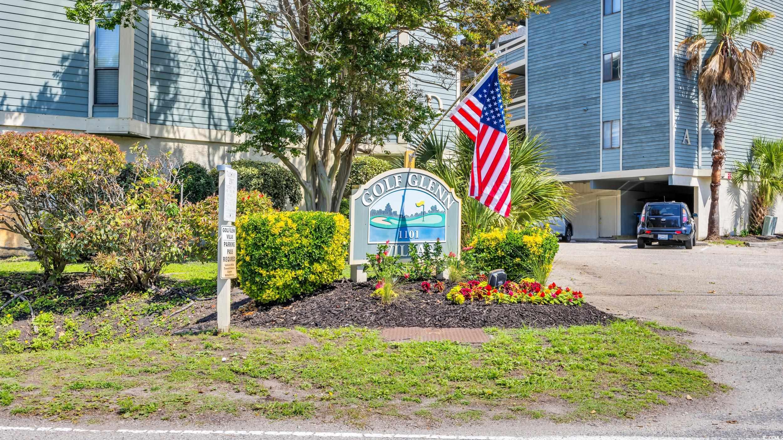 1101 Possum Trot Road, Unit C203 North Myrtle Beach, SC 29582 - Photo 29 of 29 Community sign featuring a carport