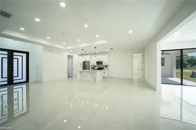 a view of a kitchen with a refrigerator and a window