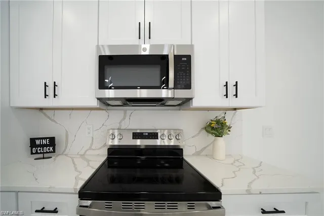 a kitchen with a stove and a microwave