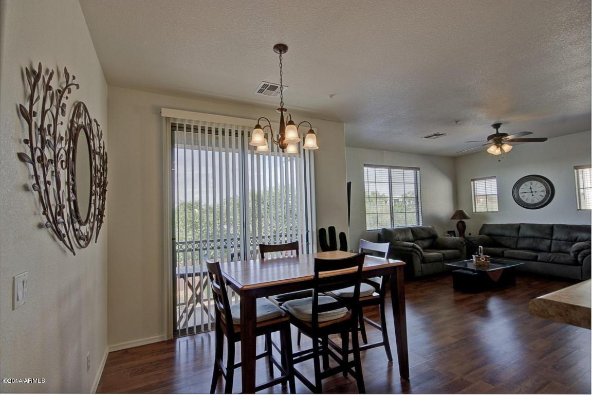 1250 South Rialto, Unit 62 Mesa, AZ 85209 - Photo 6 of 24 a view of a dining room with furniture window and wooden floor