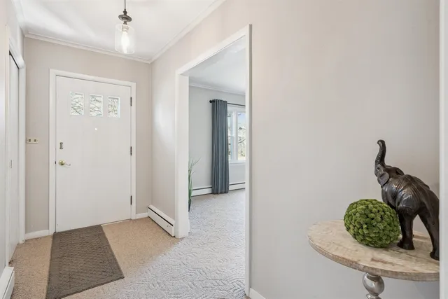 a room with painting and a table