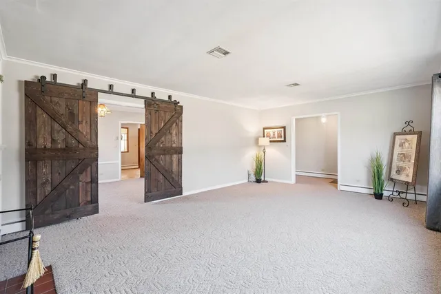 a view of a livingroom with furniture and garage