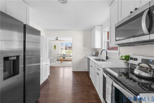 a kitchen with a counter space dining table and chairs