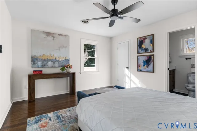 a bed room with a bed and a chandelier