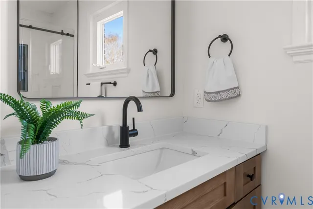 a bathroom with a bathtub and shower