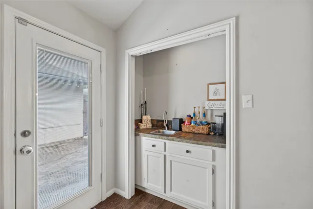 a bathroom with a double vanity sink and mirror