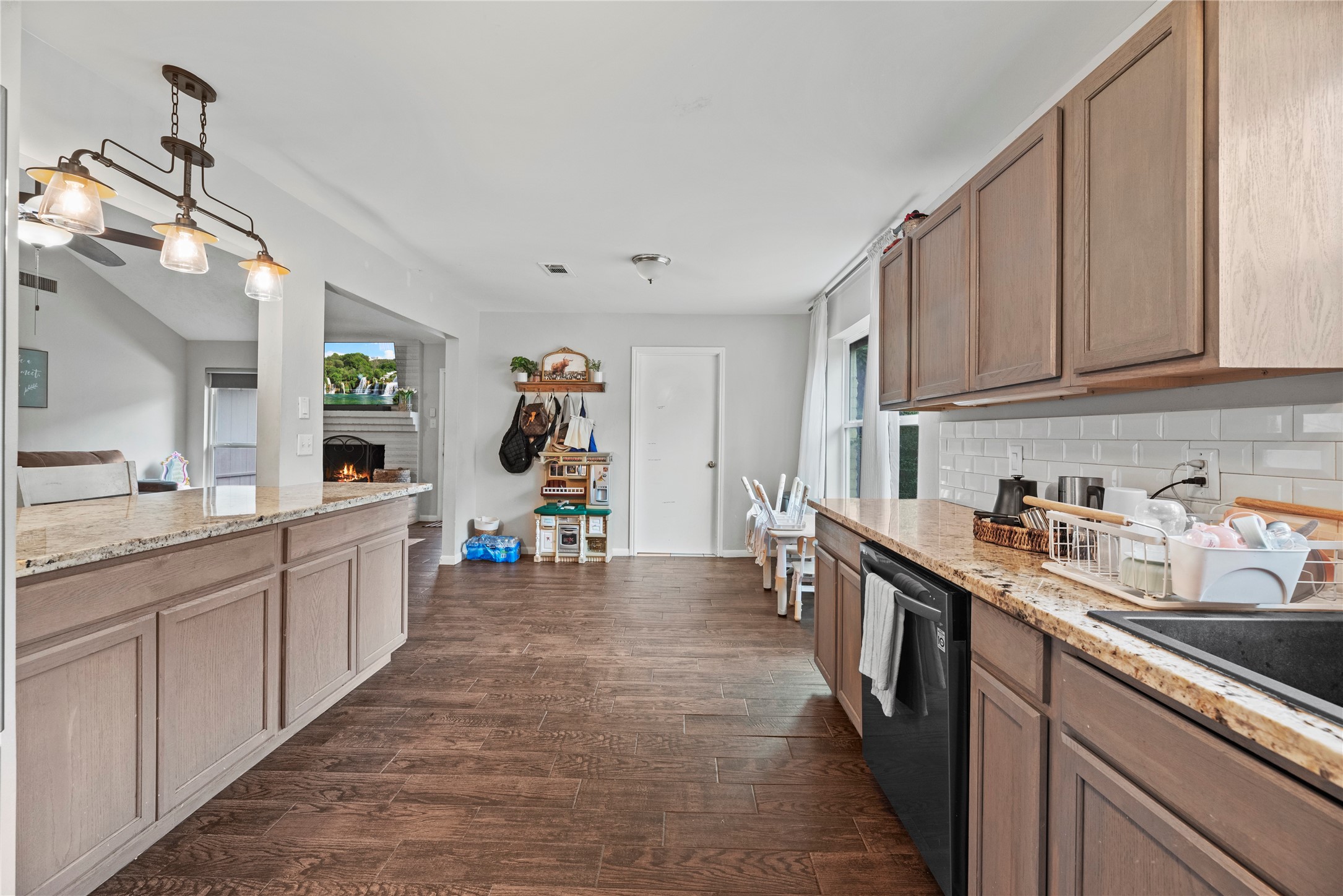 24902 Butterwick Drive Spring, TX 77389 - Photo 18 of 24 a kitchen with sink cabinets and window