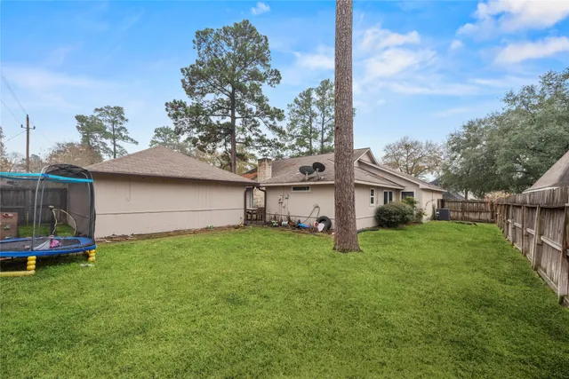a view of a house with a back yard
