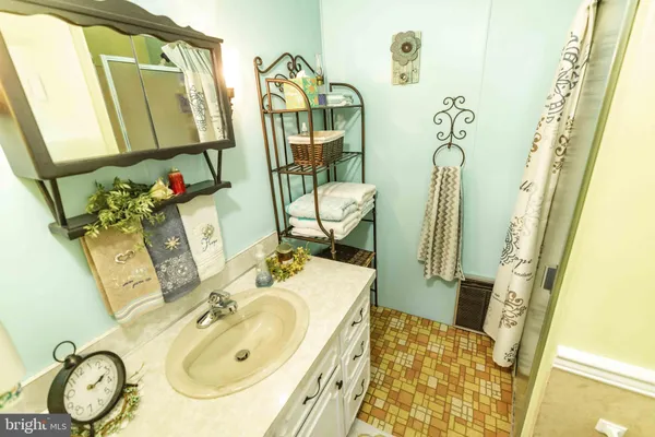 a bathroom with 2 sink and a mirror