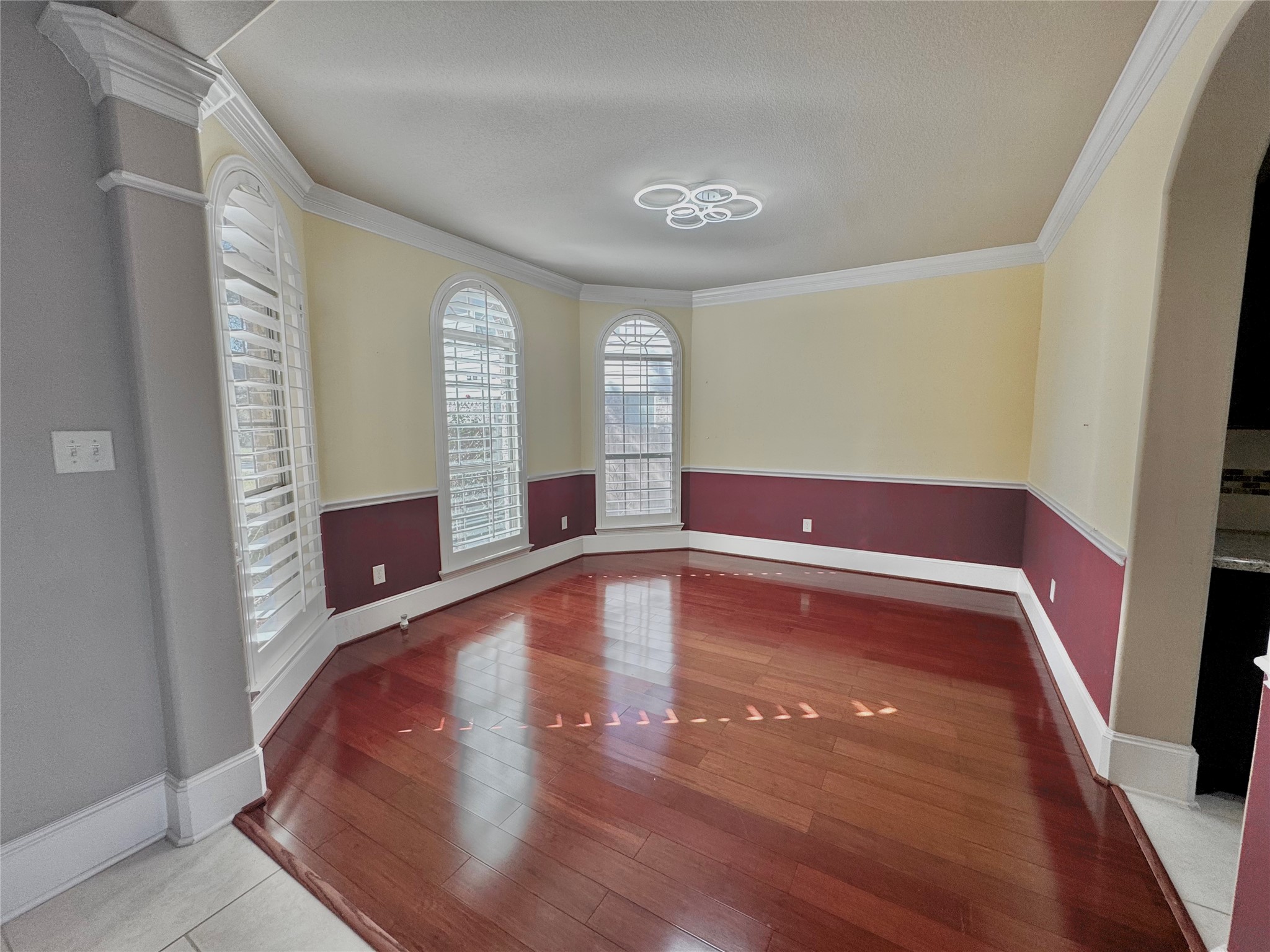 8447 Roland Canyon Drive Cypress, TX 77433 - Photo 11 of 48 a view of an empty room with window and wooden floor