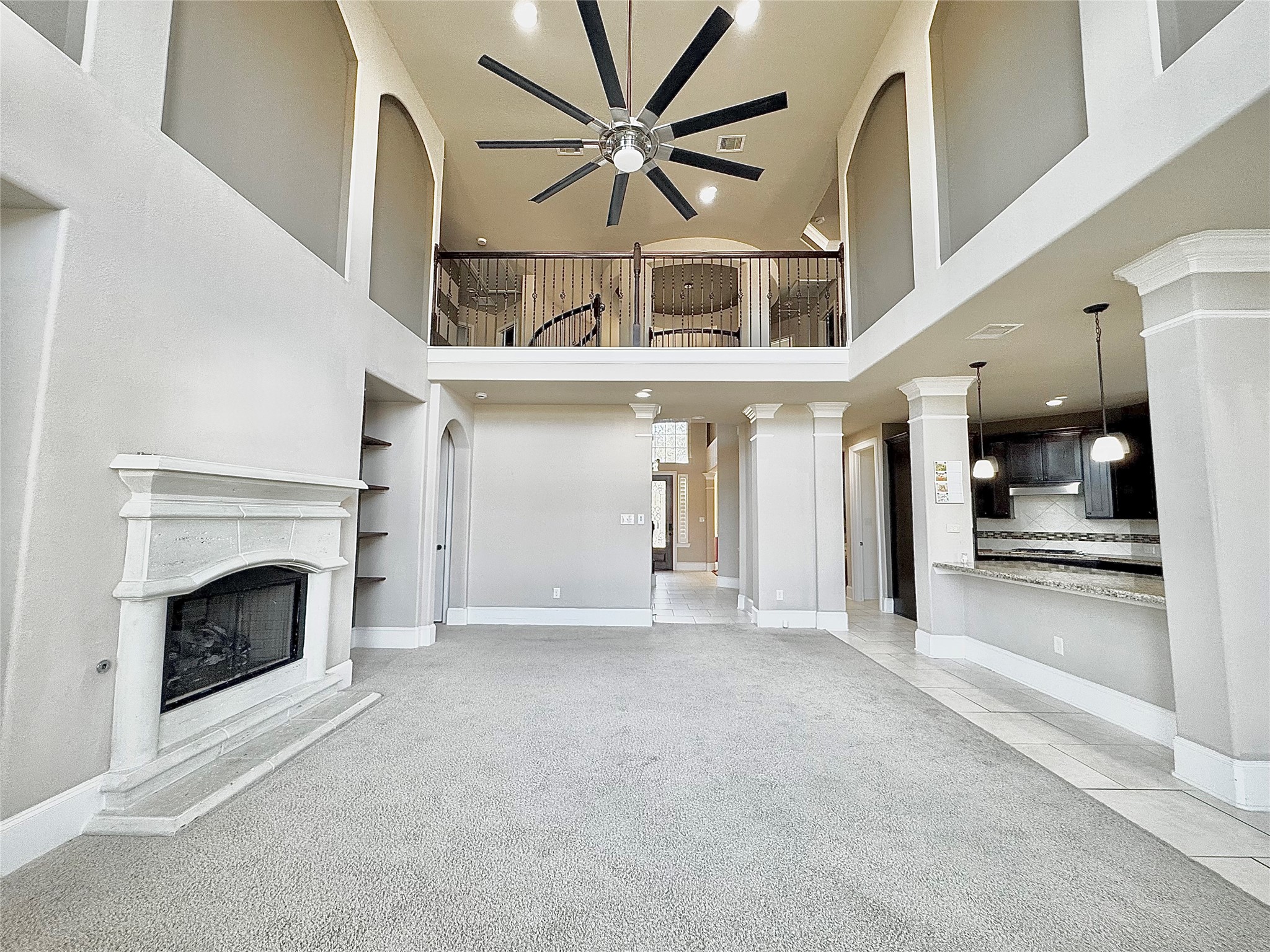 8447 Roland Canyon Drive Cypress, TX 77433 - Photo 16 of 48 a view of a livingroom with a fireplace and a chandelier