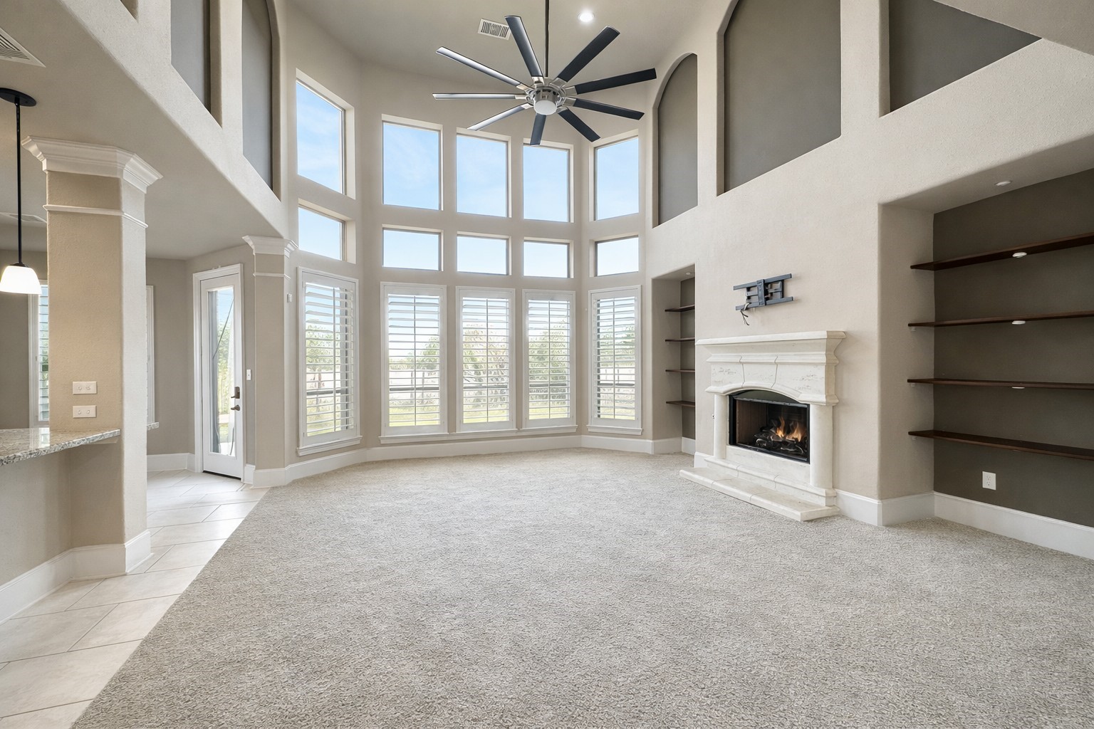 8447 Roland Canyon Drive Cypress, TX 77433 - Photo 17 of 48 a view of an empty room with a fireplace and a window