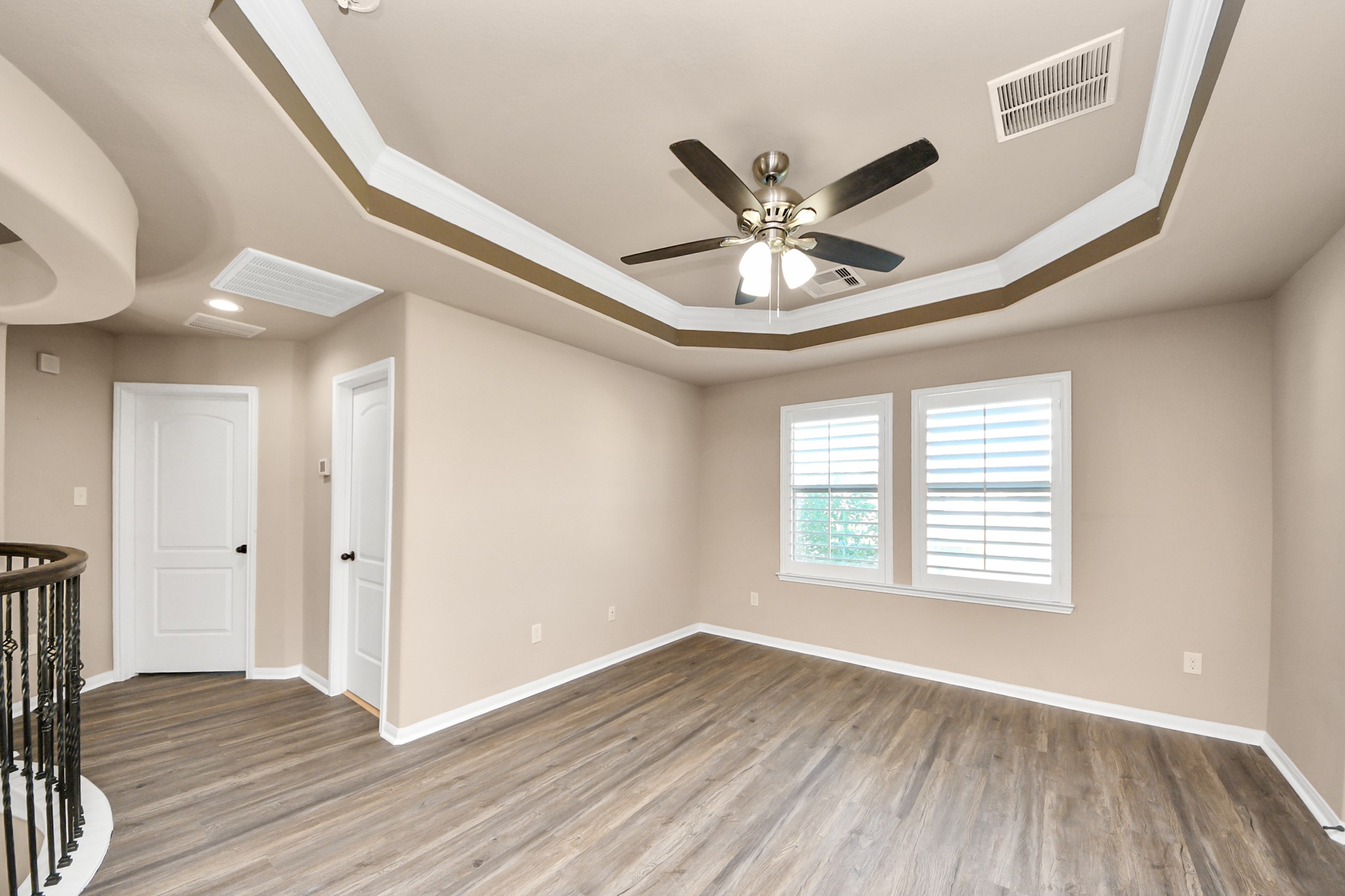 8447 Roland Canyon Drive Cypress, TX 77433 - Photo 27 of 48 a view of an empty room with wooden floor and a window