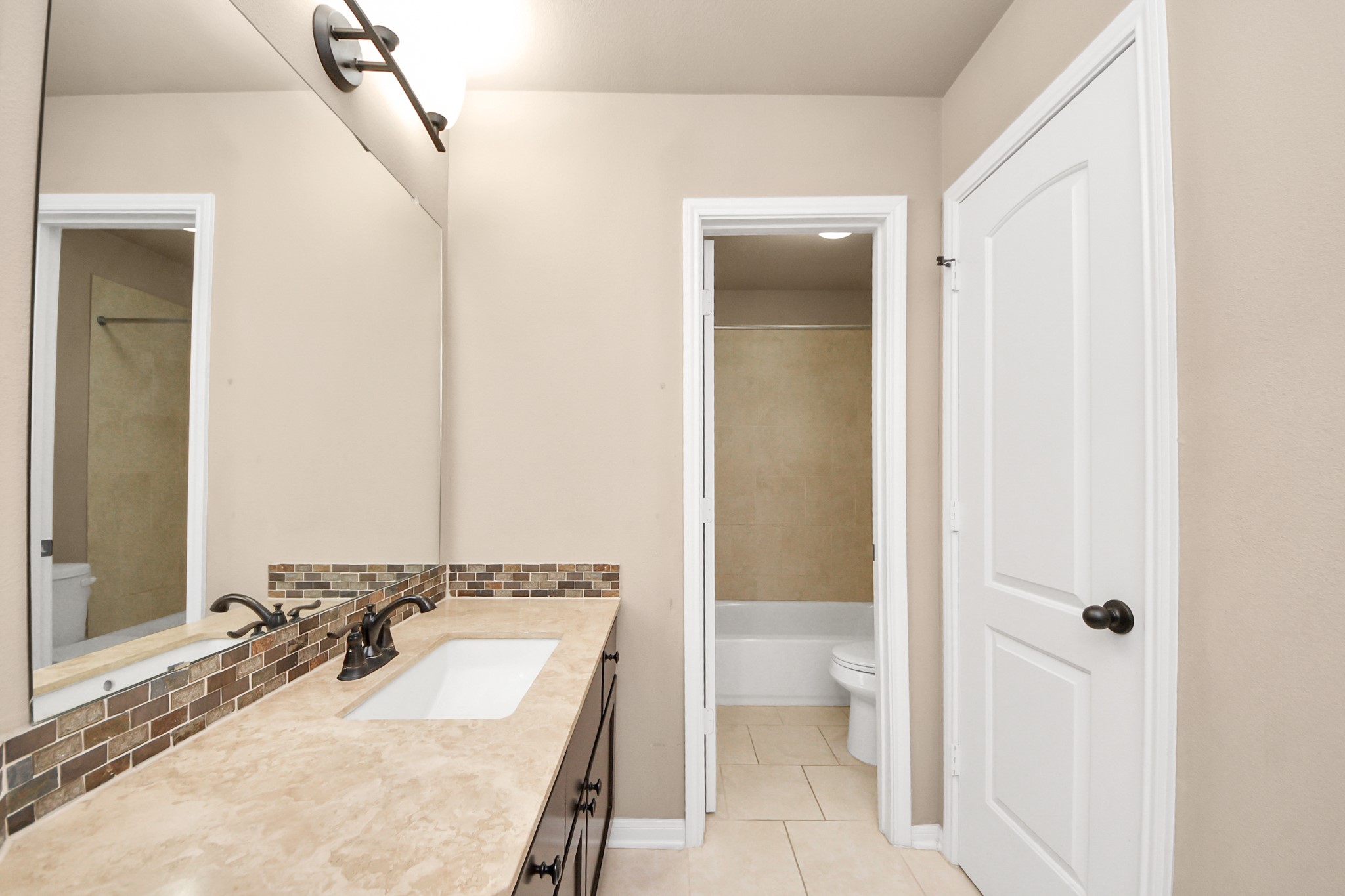 8447 Roland Canyon Drive Cypress, TX 77433 - Photo 31 of 48 a bathroom with a sink and a mirror